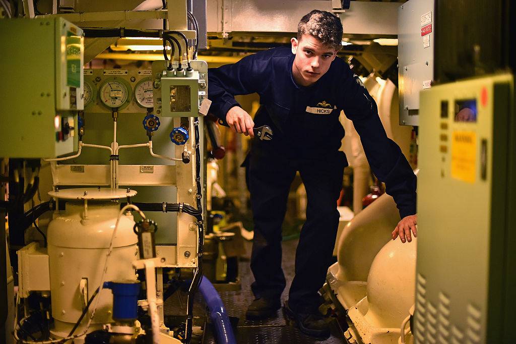 soldier working on a submarine