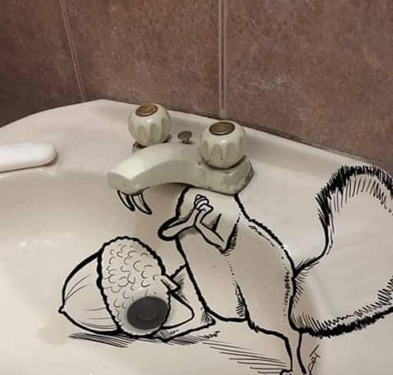 A sink faucet made to look like the rat from Ice Age