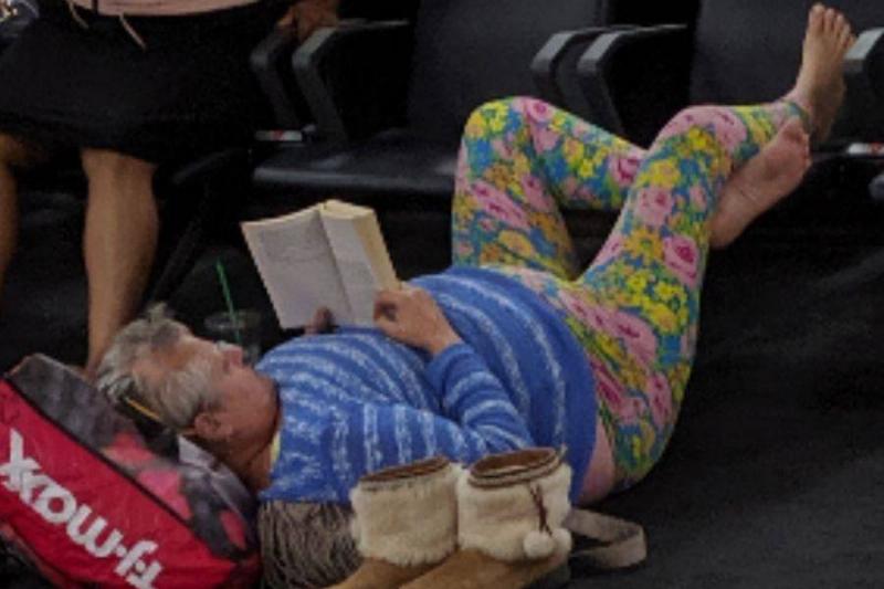 Image titleperson lounging at airportAlt Textairport lounger shoes off
