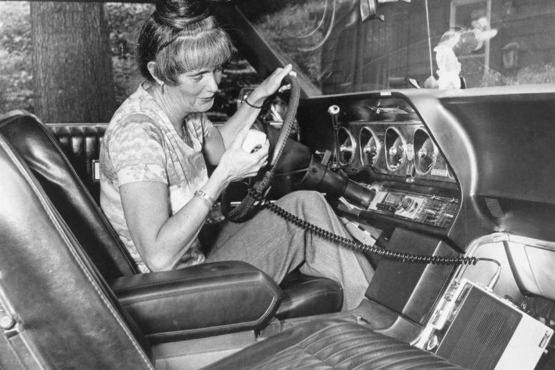 Woman Using CB Radio in Her Car Woman Using CB Radio in Her Car
