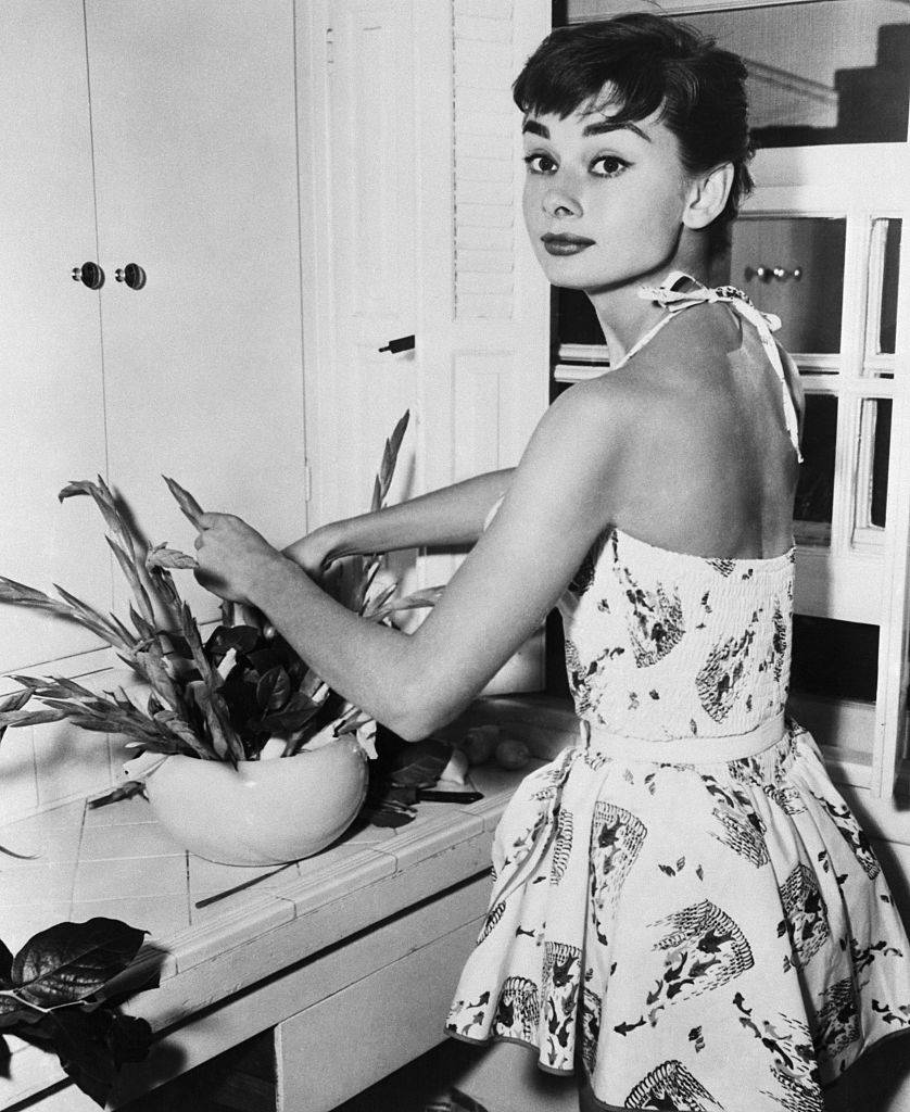 audrey hepburn taking care of plants around her home