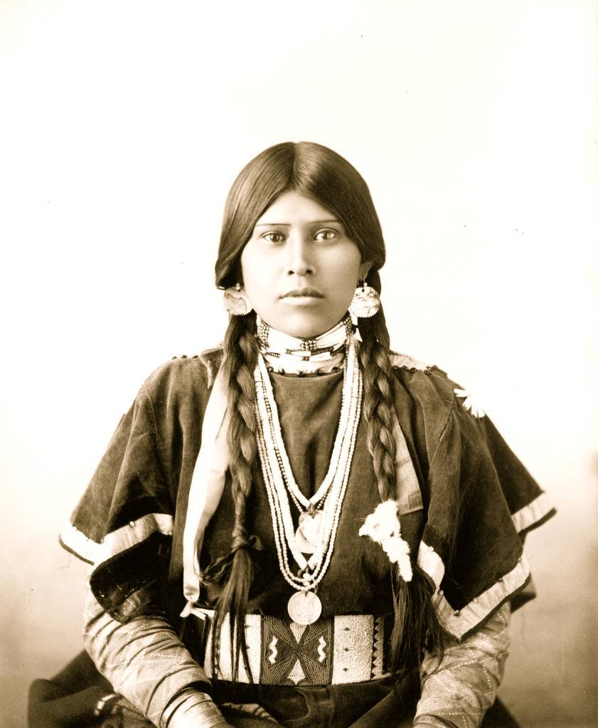 Half-length portrait of young native american woman