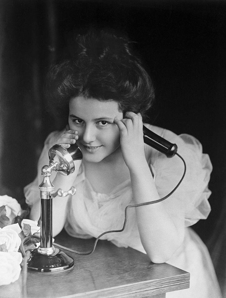 Young lady using telephone