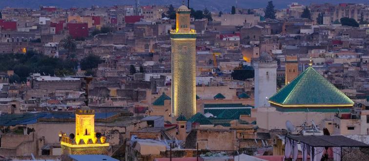 Fez, Morocco: The buildings of the University of al-Qarawiyyin, also written as Al-Karaouine or Al Quaraouiyine, are illuminated at dusk