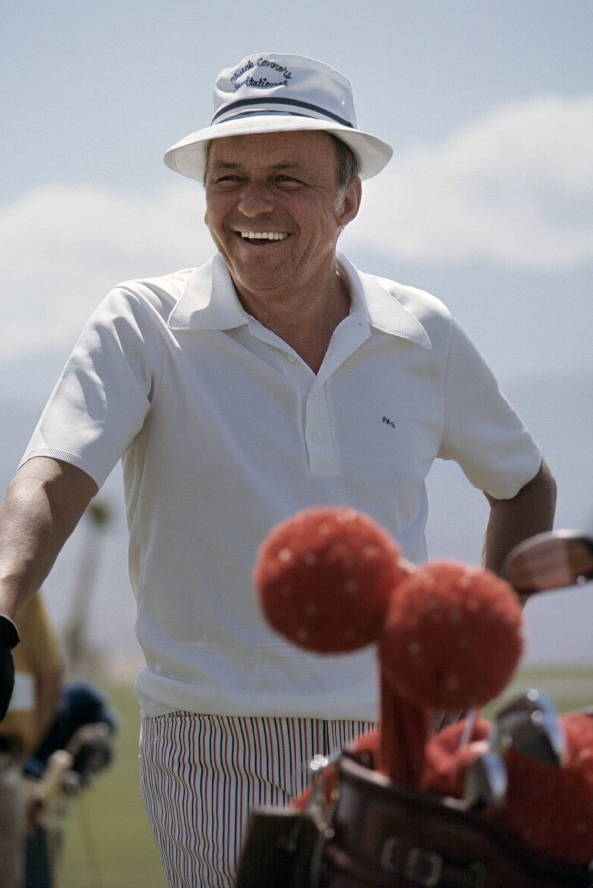 CIRCA 1975: Singer and actor Frank Sinatra plays golf circa 1975.