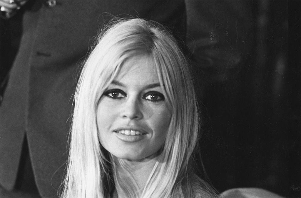 bardot posing for a photo in 1966