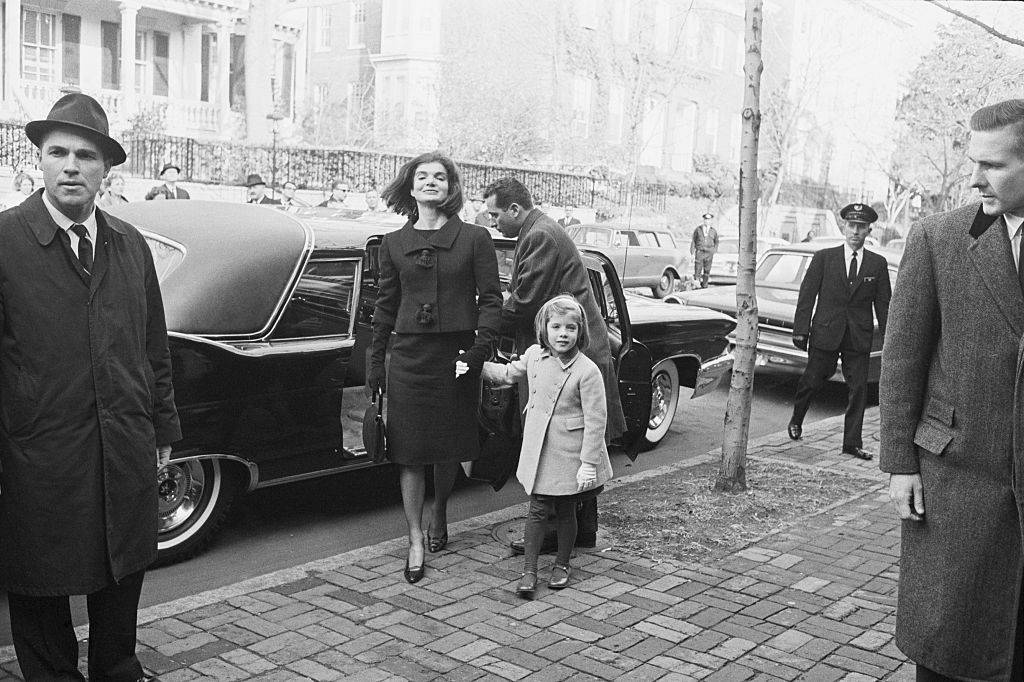 jackie kennedy leads her daughter, Caroline, into the home of W. Averell Harriman