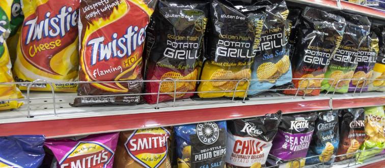 Australia, Sydney, convenience store potato chips bags competing brands display