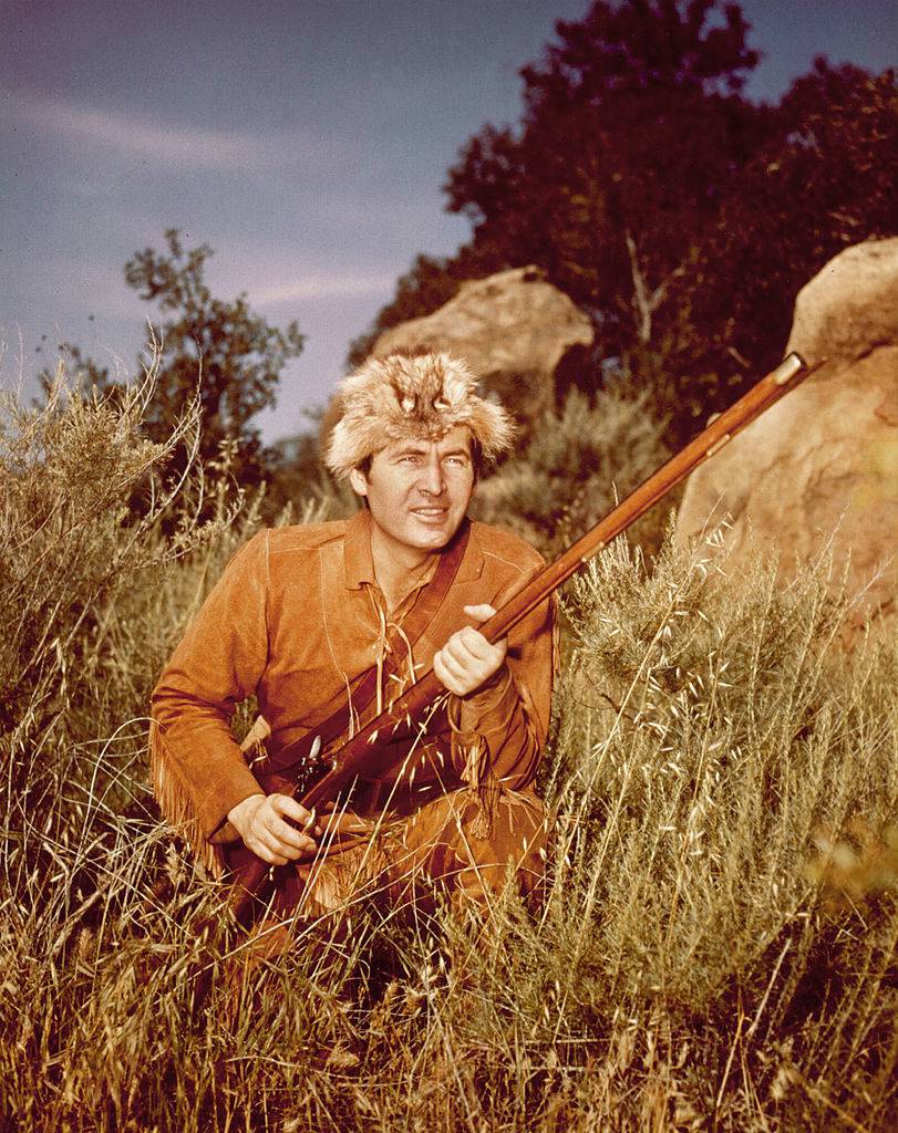 Actor Fess Parker poses in character as Davy Crockett