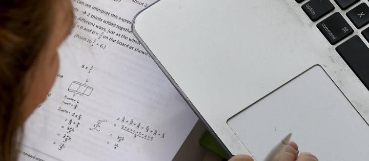 Emily Storms tutors a fifth grade math class at home via Zoom this morning on Tuesday, April 7, 2020, in San Francisco, Calif.