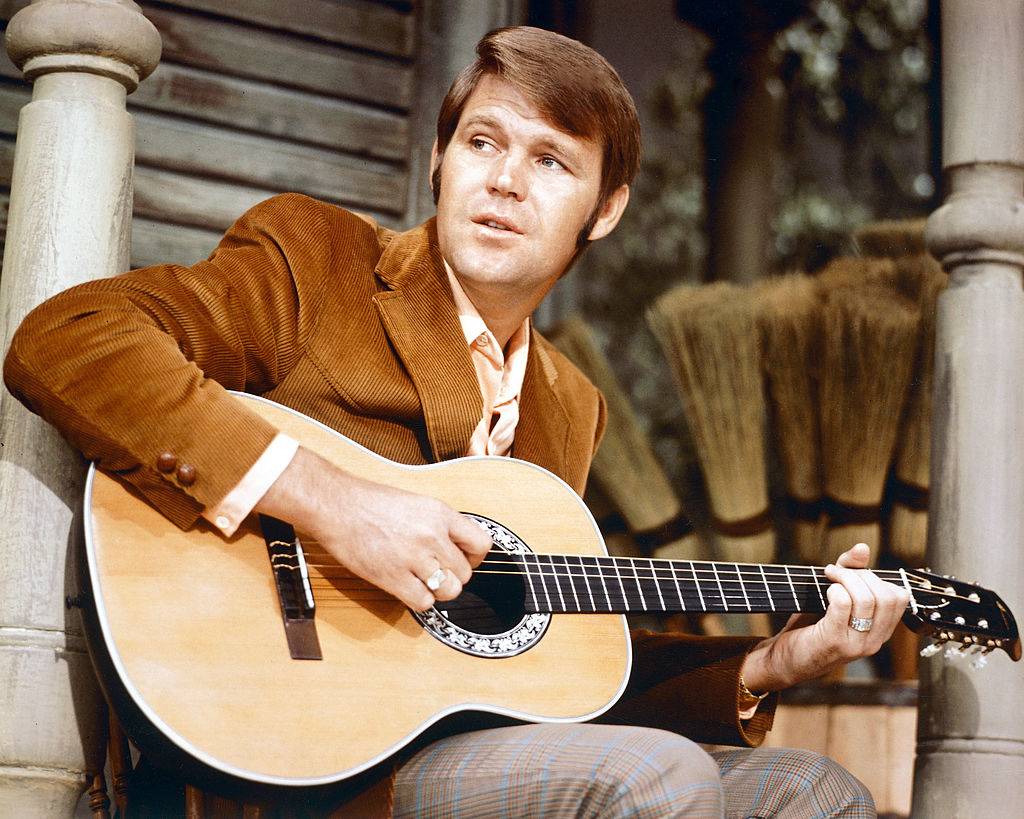 glen campbell holding a guitar