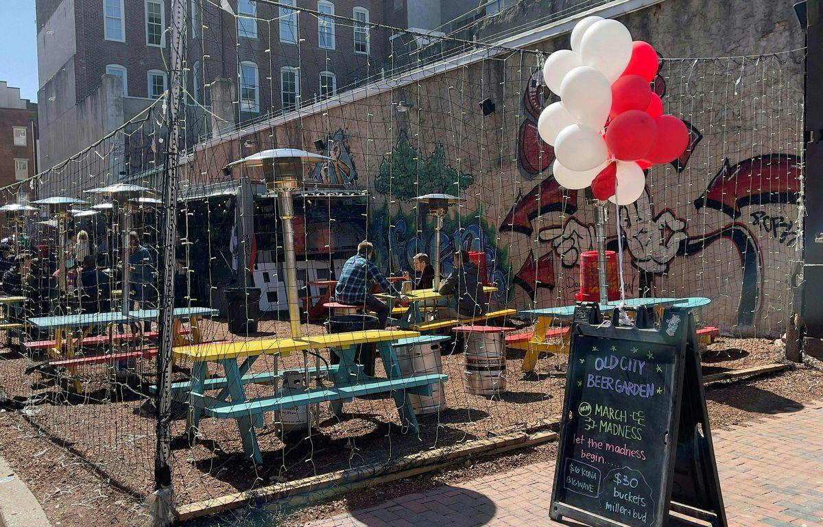 People are seen eating outside of a restaurant in old city Philadelphia, Pennsylvania,