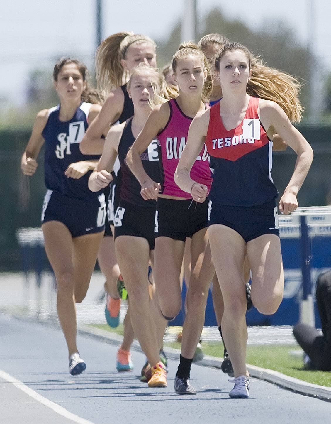Girls running in school track and field 