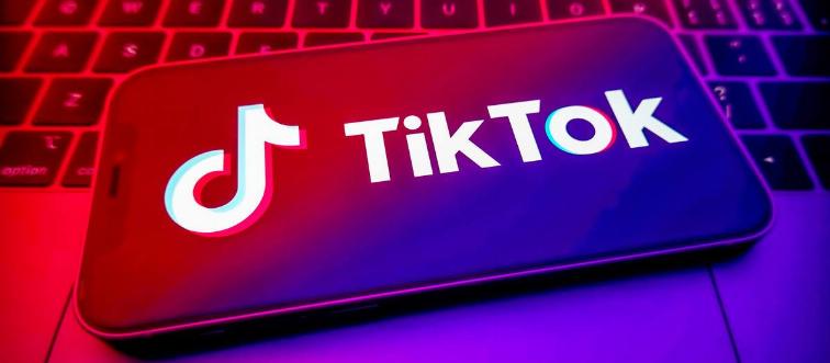 In this photo illustration, a Tik Tok logo is displayed on...