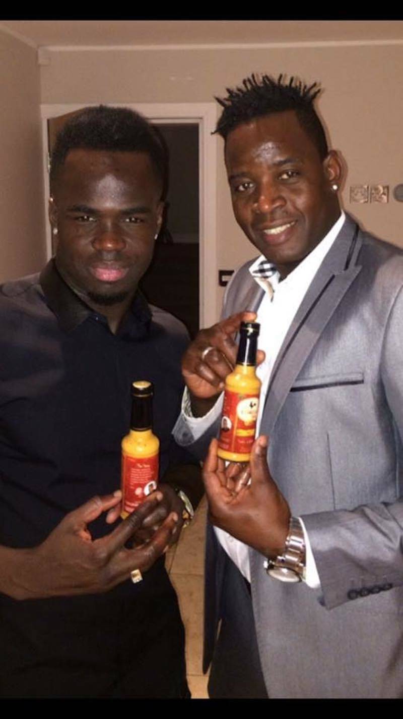 Apollo on the right holding spicy signature sauce