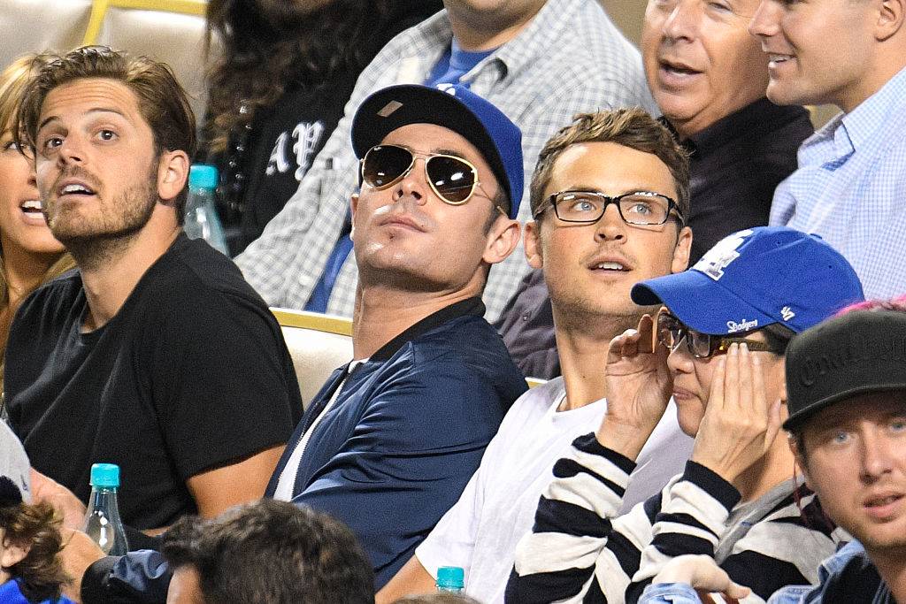 Zac and Dylan Efron at baseball game