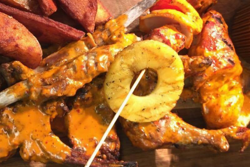 Meat and pineapple on skewer