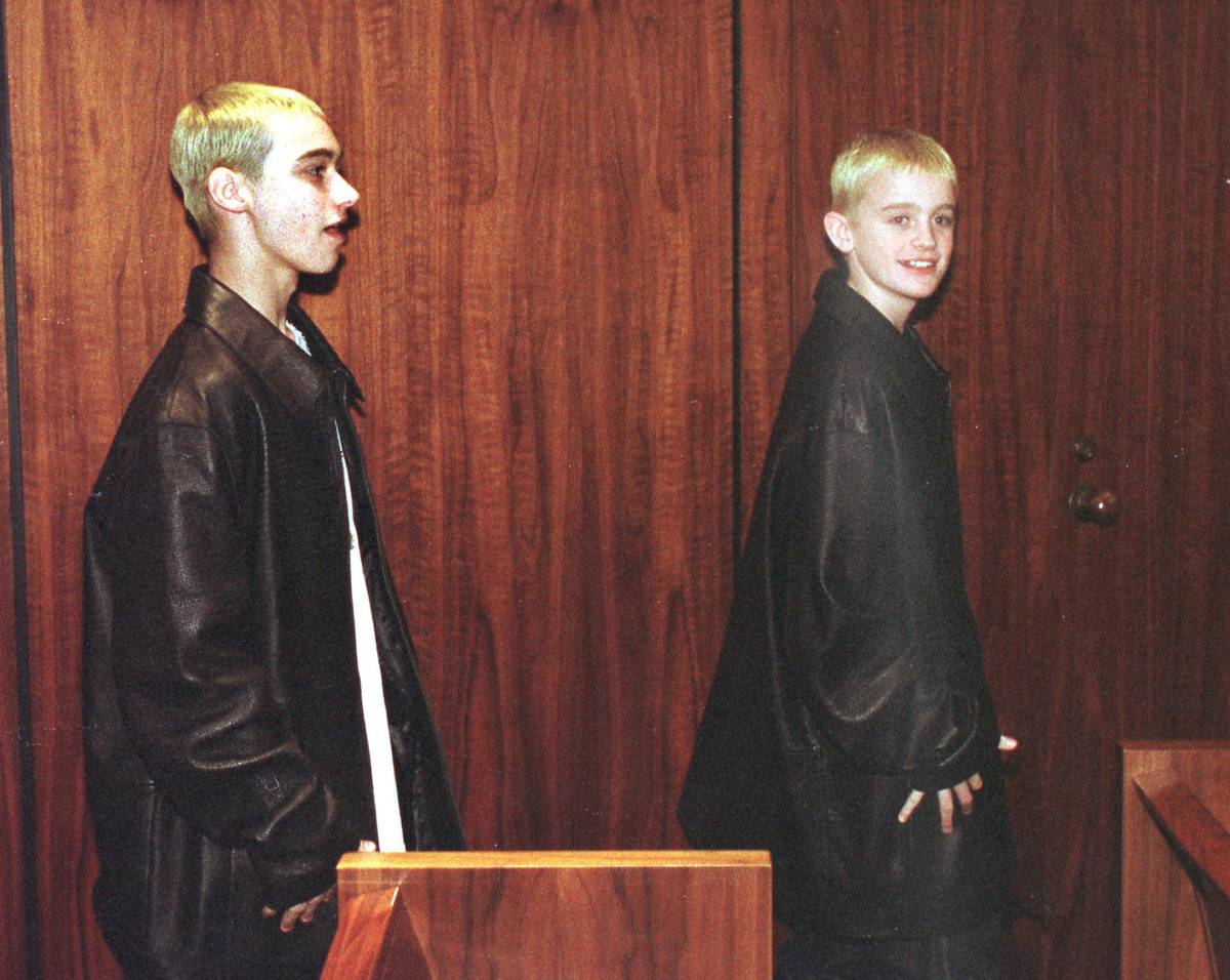 Eminem's half brother Nate, left, and his cousin Joshua Schmitt exit a Macomb County courtroom following Eminem's (Marshall Mathers) sentencing