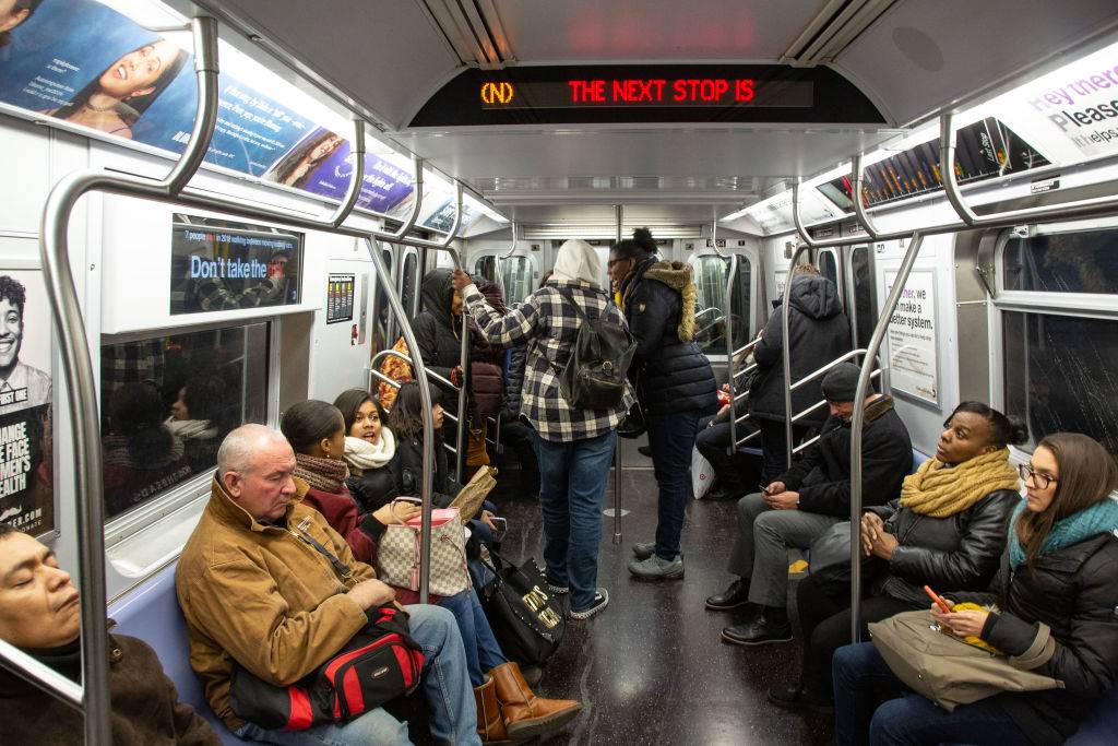 People riding the subway transit system