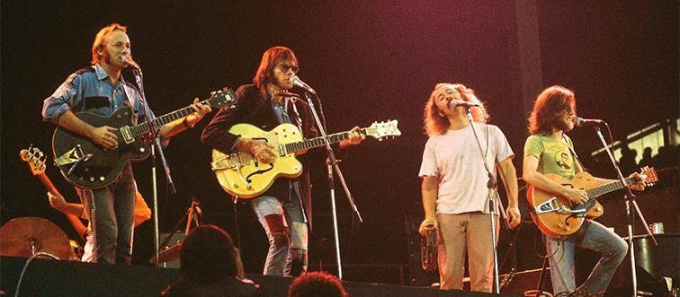 70s rock band on stage
