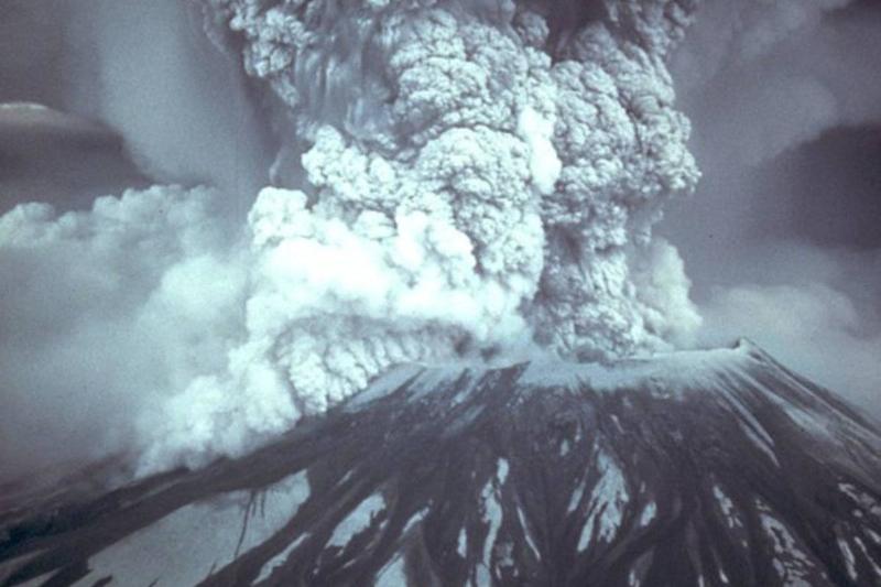black and white photo of a volcano erupting