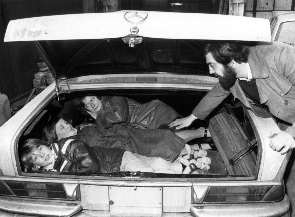People escaping East Berlin in a car trunk