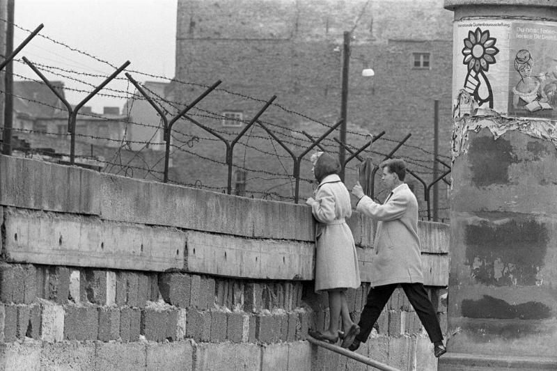 People looking over Berlin Wall