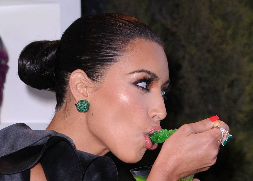 Kim Kardashian eating green candy