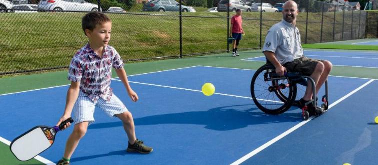 Child playing Pickleball