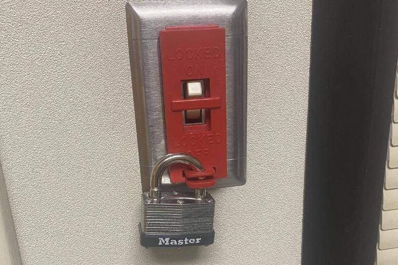 Locked light Padlock over light switch