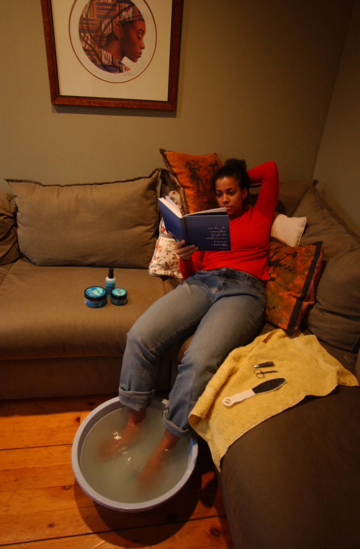 12/23/03 pics of linette robinson who can make anywhre in her house a cozy place in her living room having a footbath or in her bath relaxing with oils