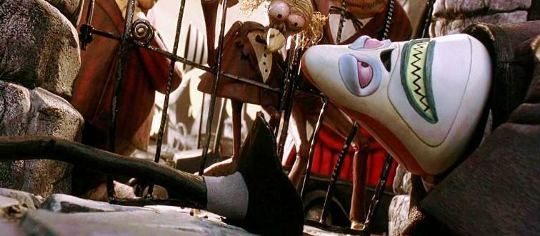 Mayor of Halloween Town laying down in anguish in front of gates