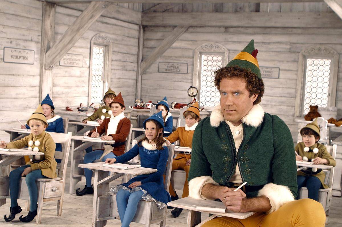 Will Ferrell sitting among elf kids in school as Buddy in Elf