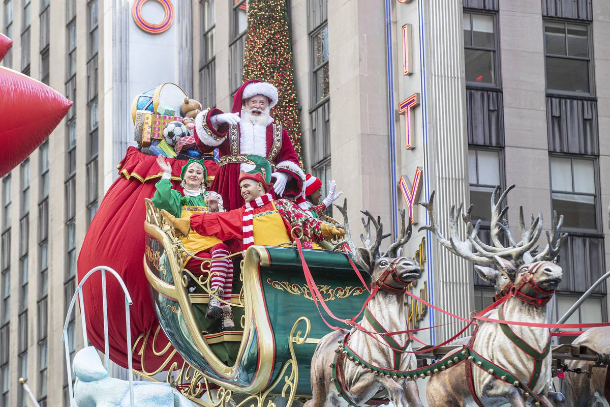 Float with Santa Claus concludes 96th Macy's Thanksgiving Day Parade along streets of New York.