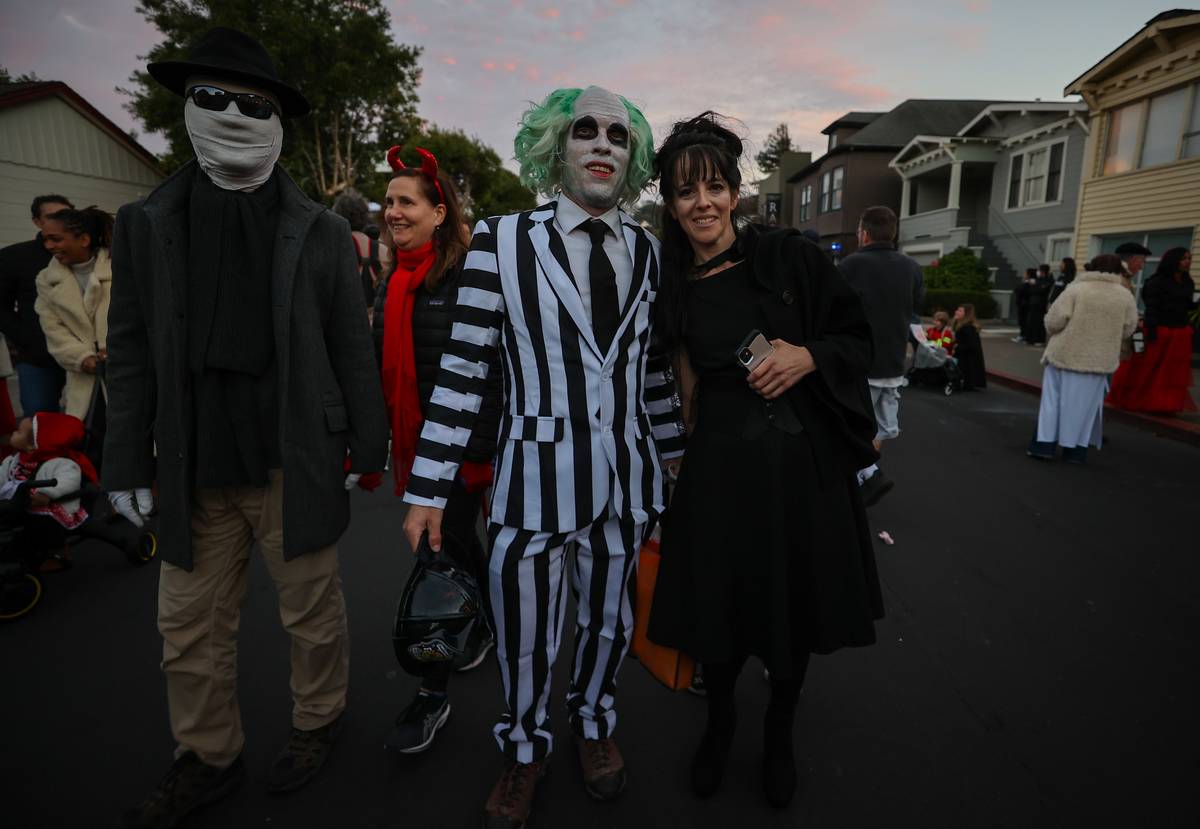 Parade participants in costume attend the 2022 Halloween parade in Sausalito, California, United States on October 31, 2022.