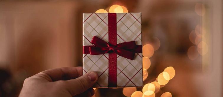 small Christmas present in hand