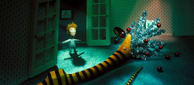 snake with a mouth full of tinsel scares child