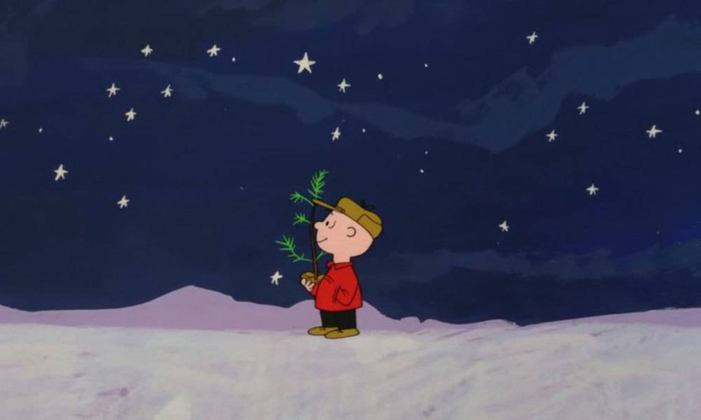 Charlie Brown carrying tiny Christmas tree in A Charlie Brown Christmas