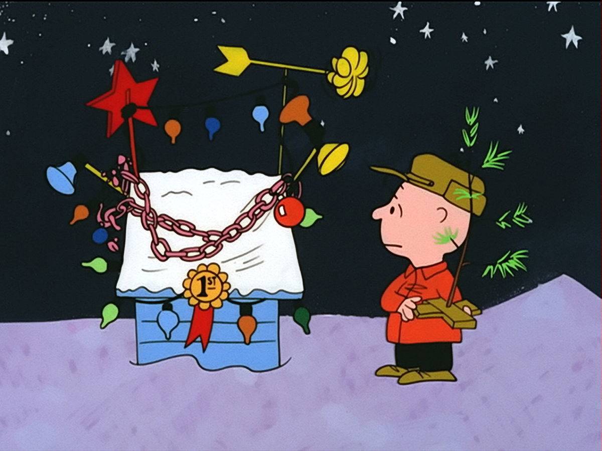 Charlie Brown looking at Snoopy's doghouse in A Charlie Brown Christmas