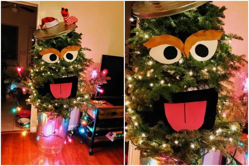 Christmas tree with Oscar the Grouch face sticking out of garbage can