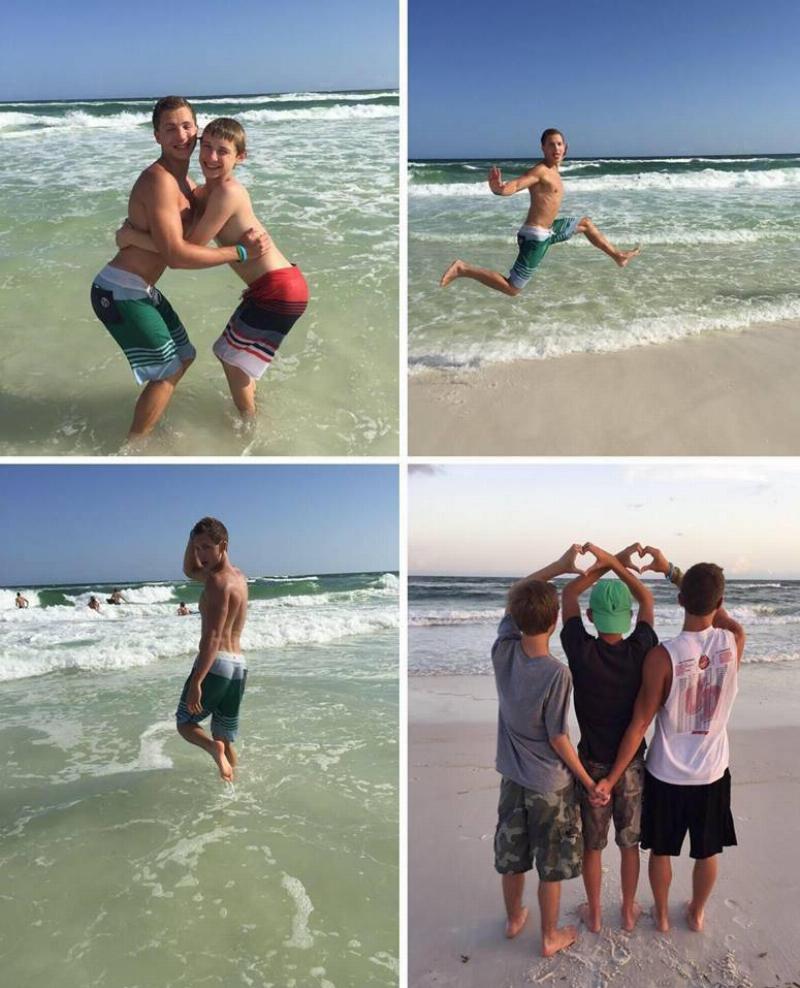 group of guys posing at the beach