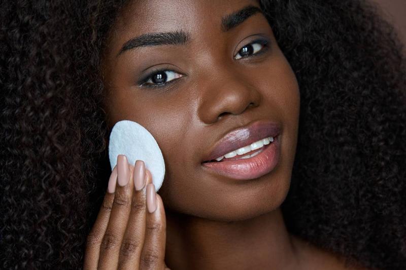 black-young-woman-holding-cotton-pad-removing-face-2021-10-19-16-09-26-utc