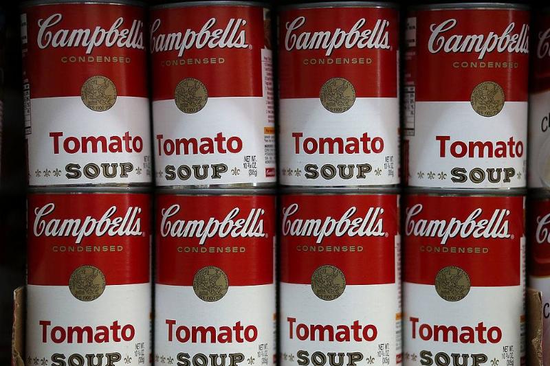 canned soup 169124935 Cans of Campbell's tomato soup are displayed on a shelf