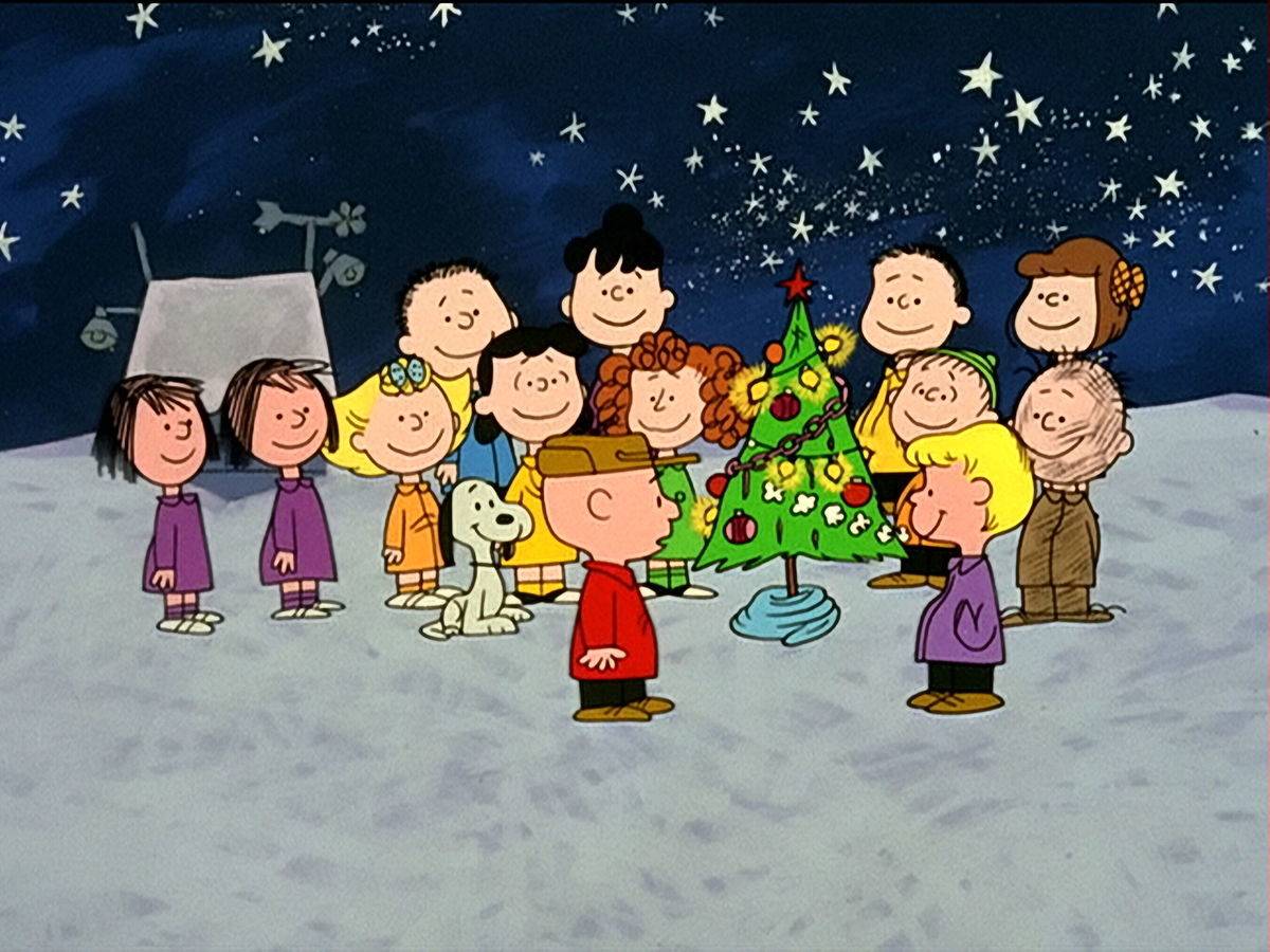 children standing around decorated Christmas tree in A Charlie Brown Christmas