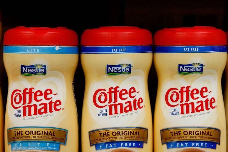 coffee creamer 79897920 Containers of Nestle Coffee Mate coffee creamer are displayed on the shelf