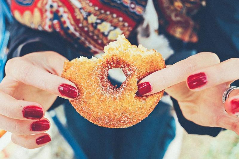 donut woman holding a donut