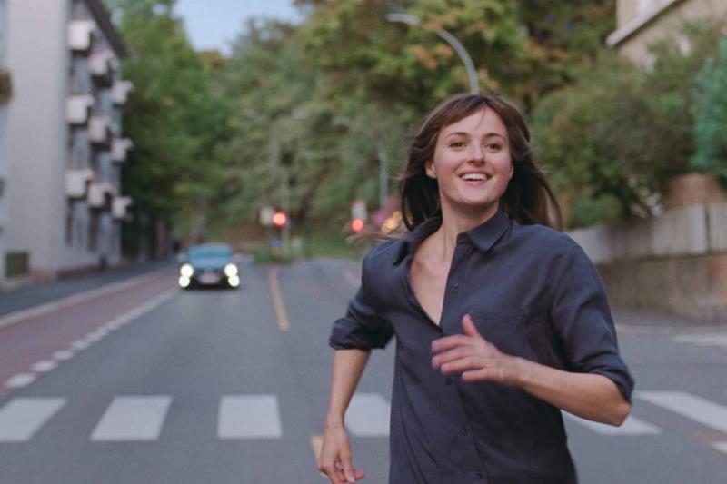 the-worst-person-in-the-world_9Htmun woman running down the street smiling