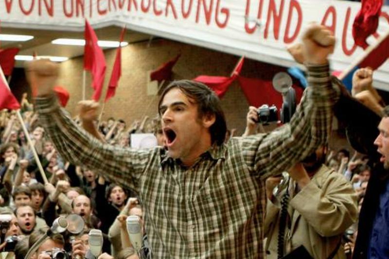 Man screaming amid crowd of Marxists waving red flags in The Baader-Meinhoff Complex Man screaming amid crowd of Marxists waving red flags in The Baader-Meinhoff Complex