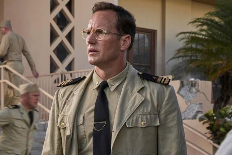 Patrick Wilson looking shocked as sailors run behind him in Midway Patrick Wilson looking shocked as sailors run behind him in Midway