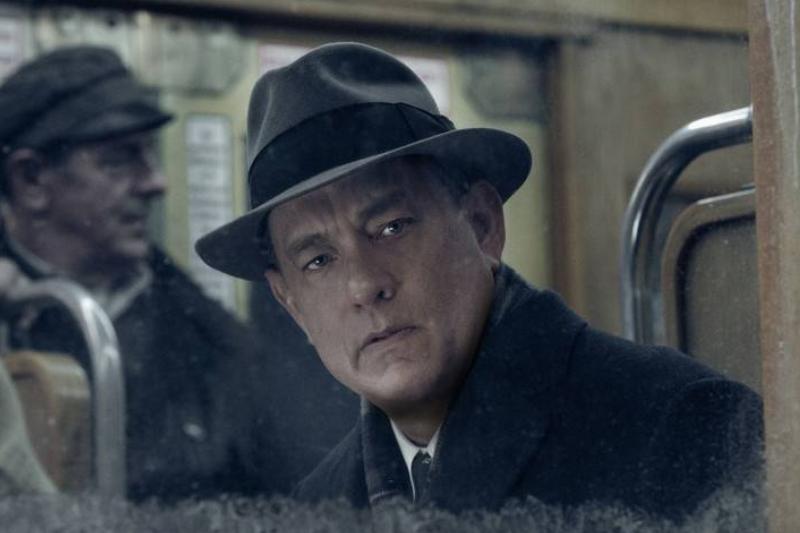 bridge-of-spies_otXIGp Tom Hanks as James Donovan looking out the window of train in Bridge of Spies
